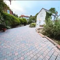 After picture on a large blue and red block paving patio